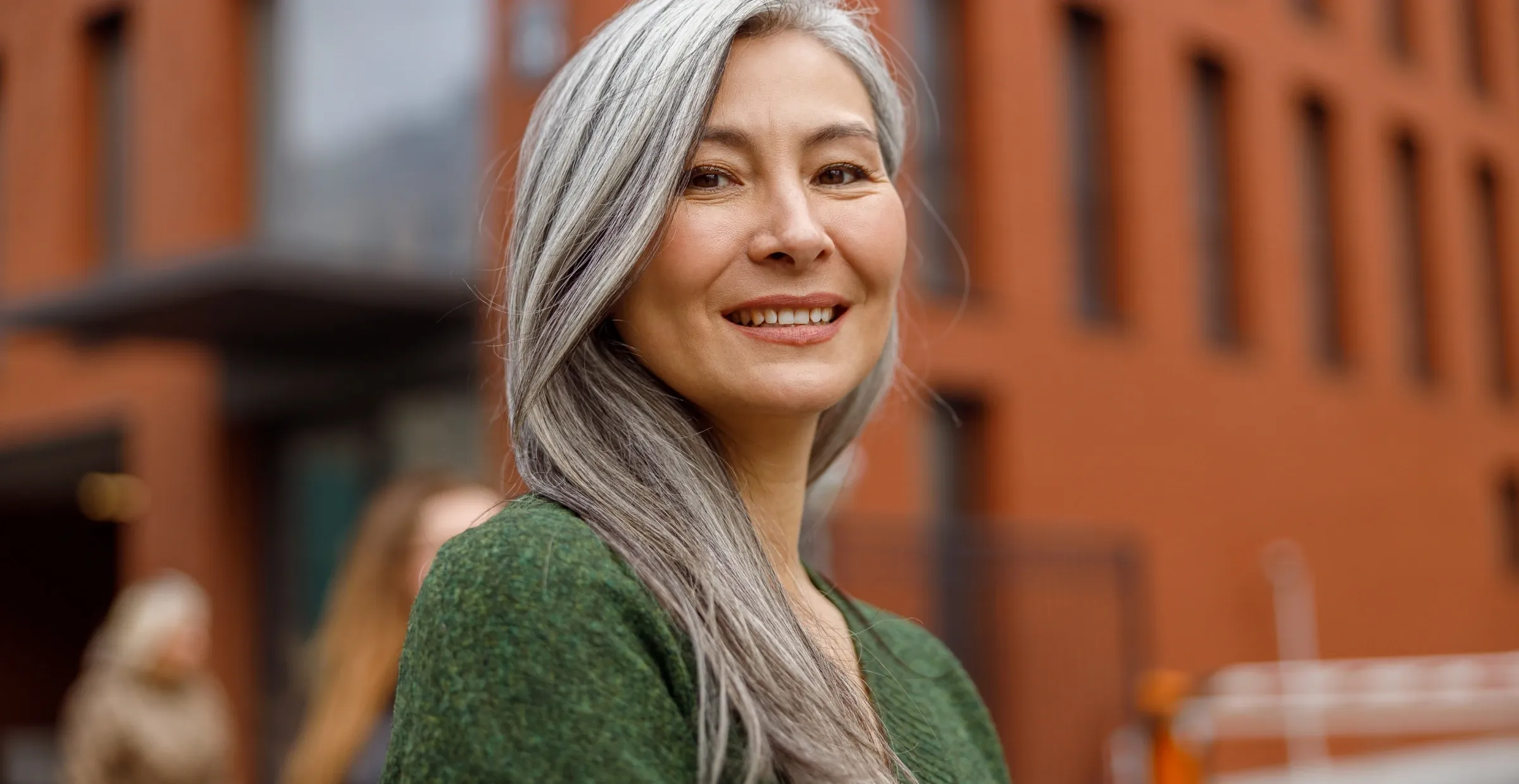 portrait of aging woman in city street