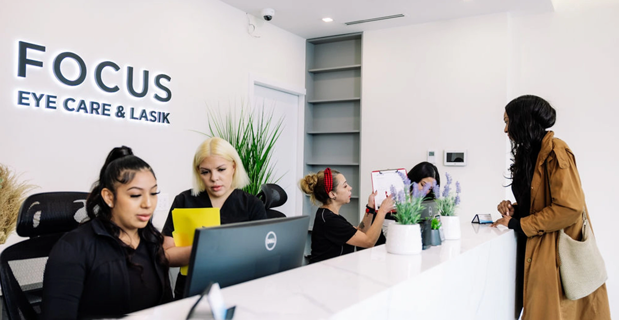 patient standing at front desk at Focus Eye Care & LASIK